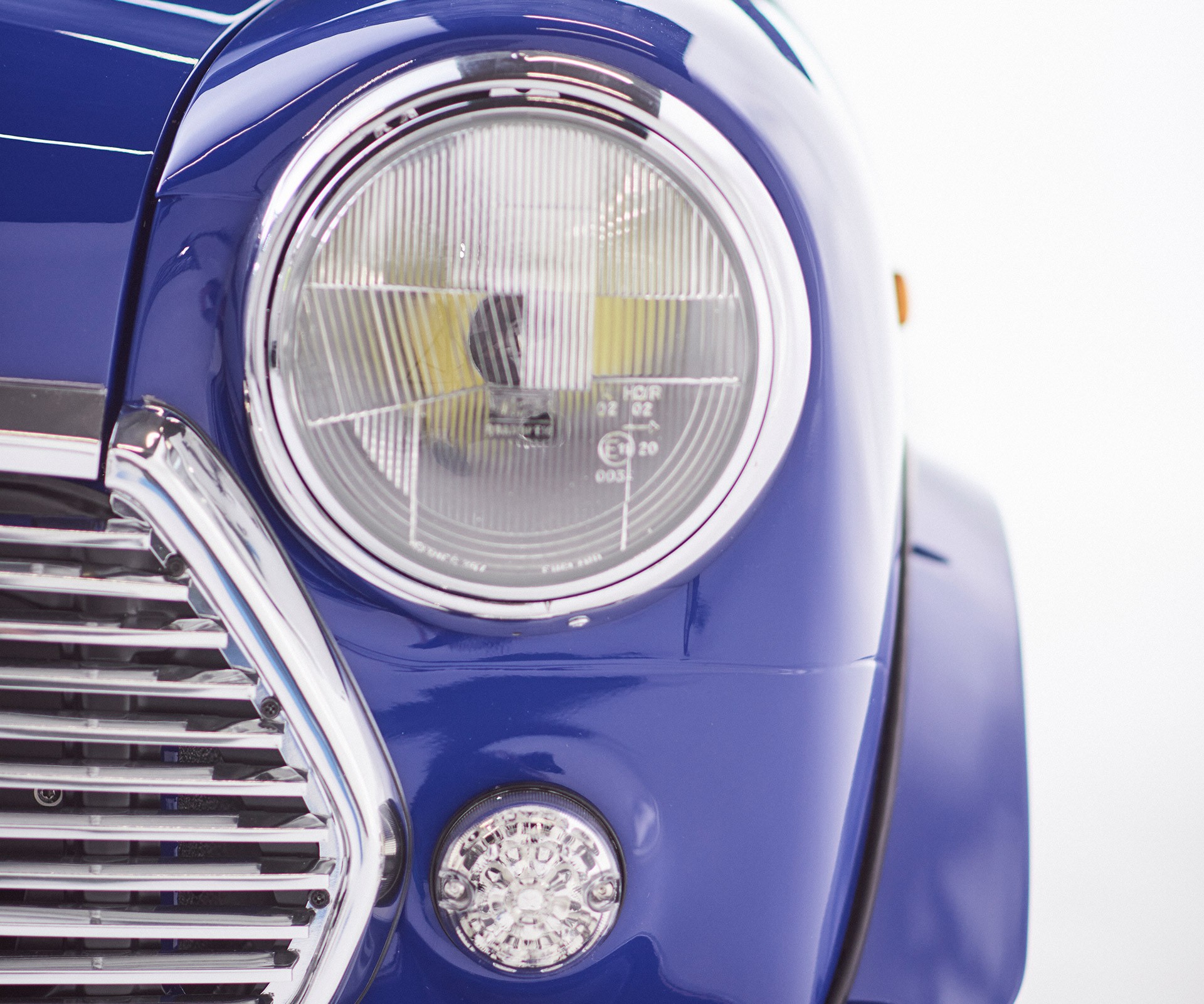 Close-up of a headlight of the MINI Recharged model.